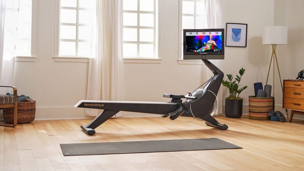 NordicTrack rowing machine positioned in a bright home space, showcasing a compact, connected cardio setup.